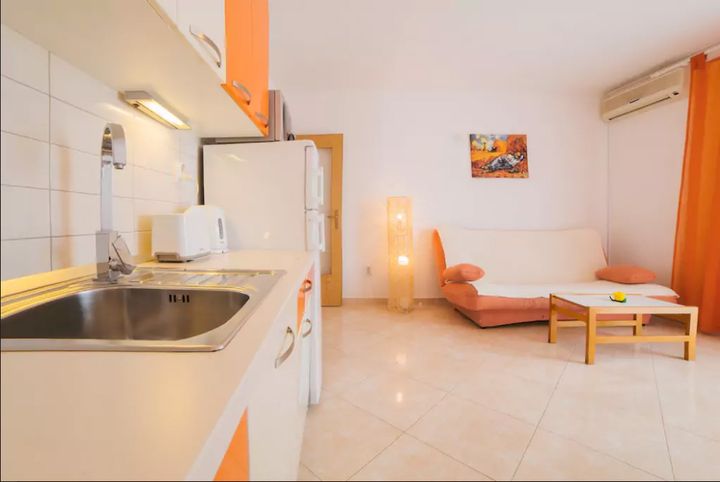 Apartment A1 – Kitchen and sofa